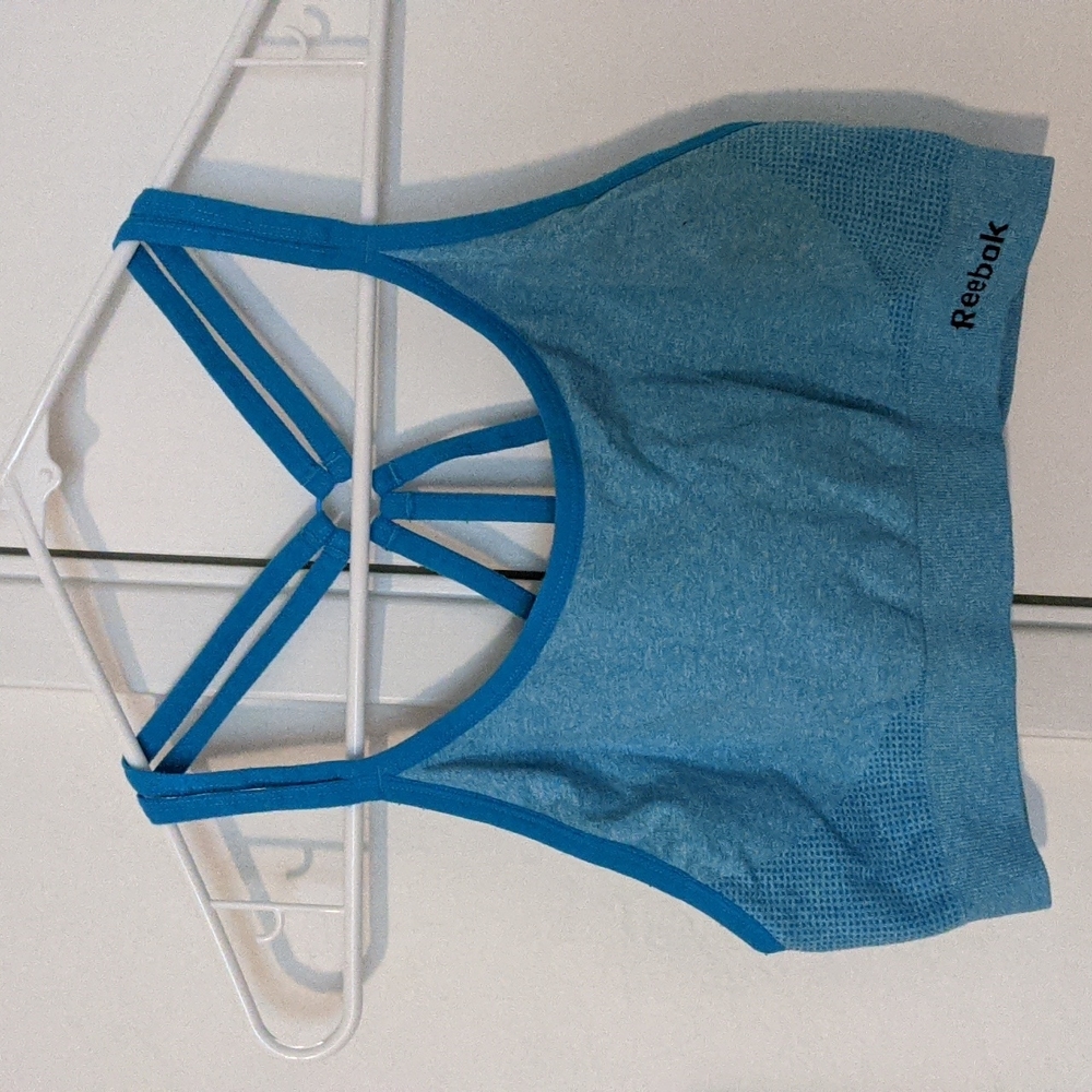 Reebok sports bra size medium bright blue strappy cross back